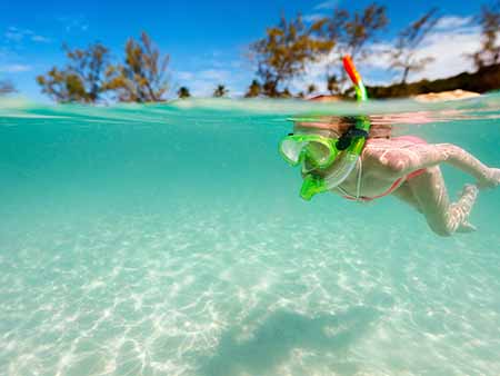 Girl snorkelling in Mamanuca, Fiji