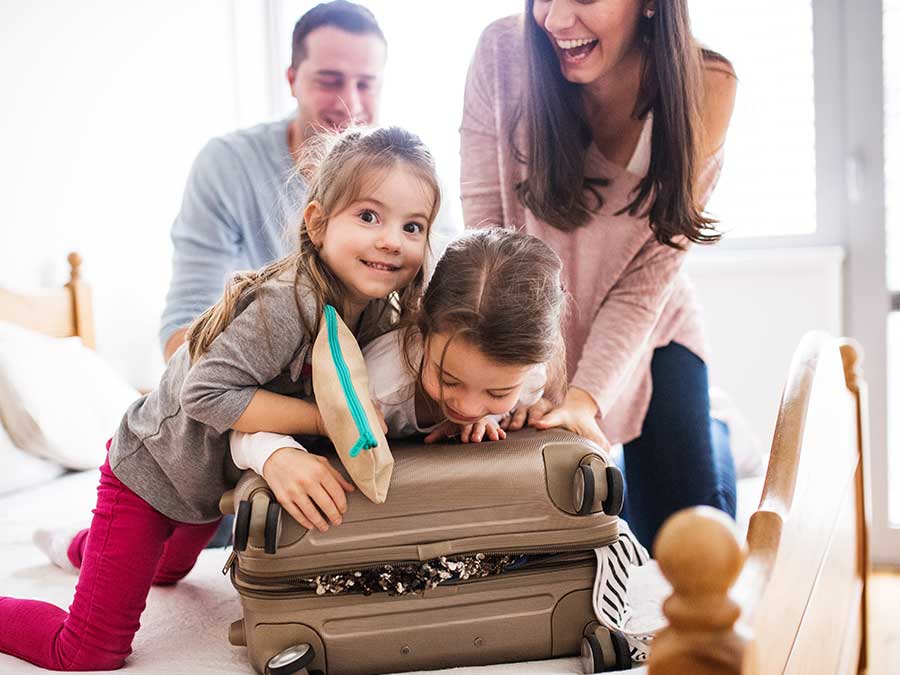 Family packing bags for a cruise