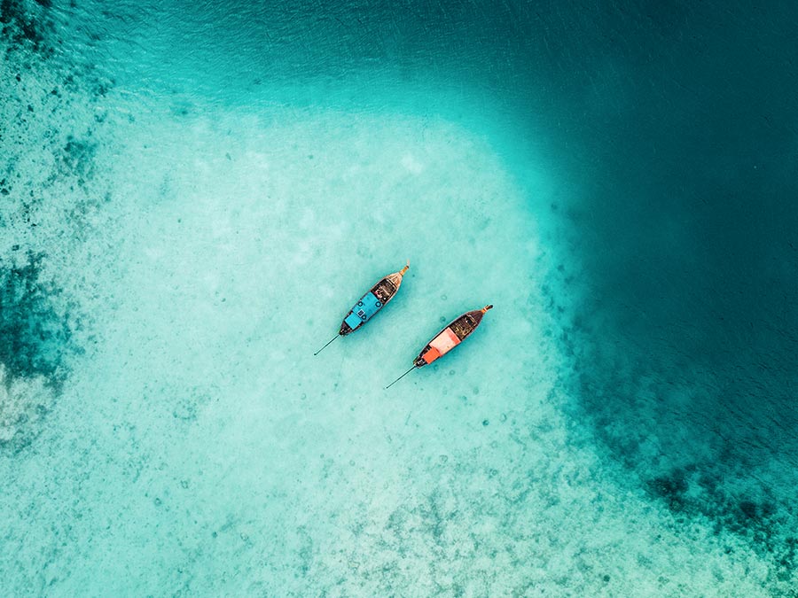 Scenic aerial view of two boats on sea in Thailand