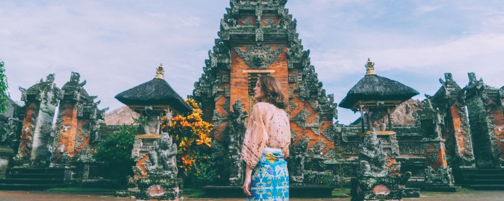 Woman in front of a temple