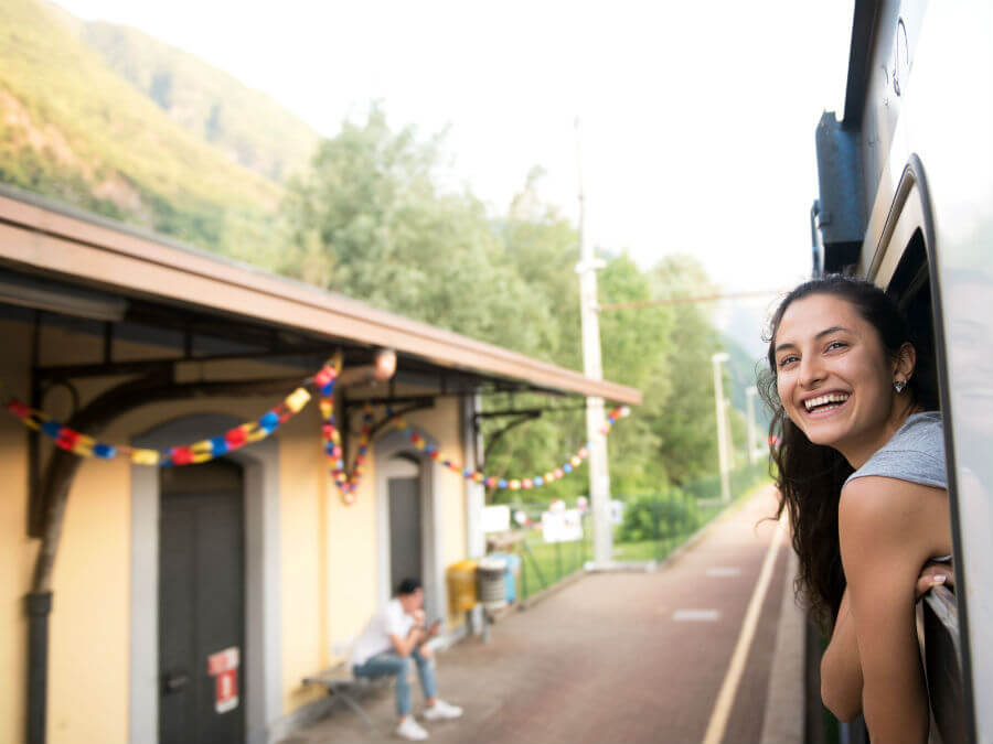 Girl on the train getting her head out of the window to see the view