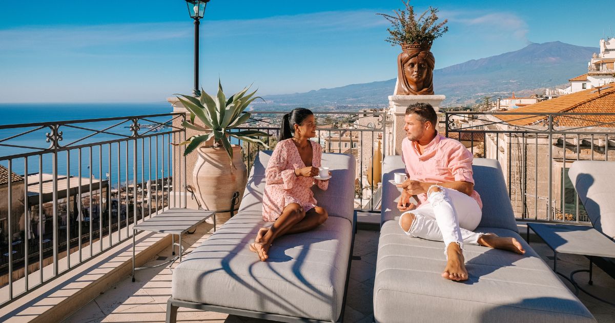 Couple on balcony in Italy