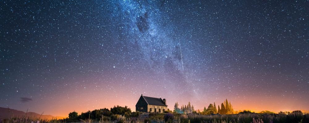 Cabin against starry night sky