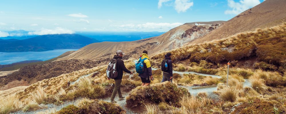 Three people hiking on mountain