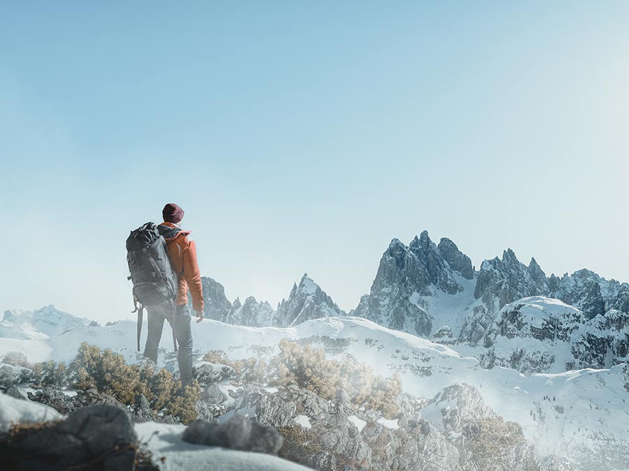 Man hiking snowy mountain