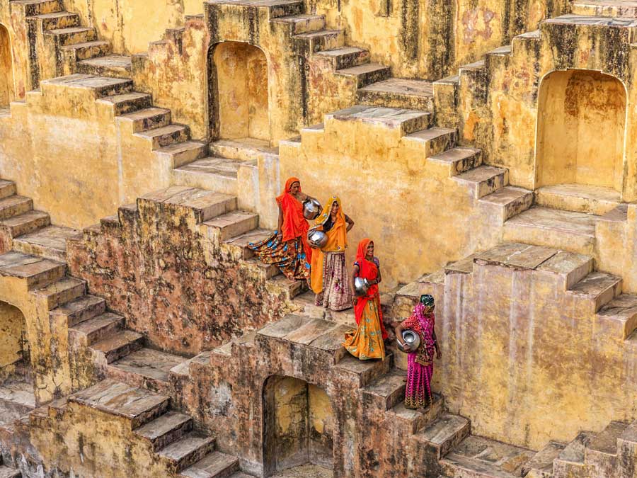 Indian women carrying water from stepwell near Jaipur, Rajasthan, India