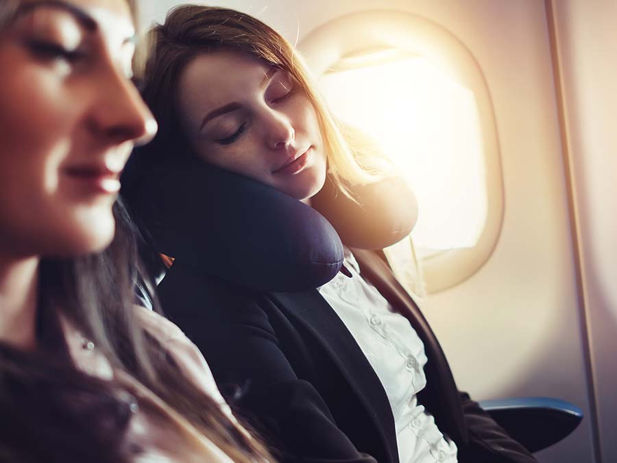 Woman sleeping on plane